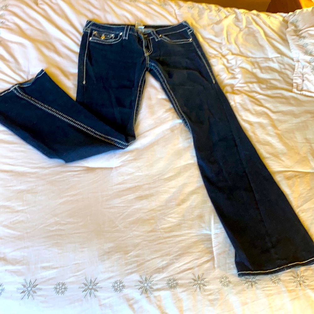 New Religion flared jeans with rhinestone studs and stitching detail.